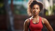 © venusvi - Confident young black woman wearing a sports tank top after exercising