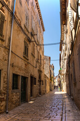 Wall Mural - A quiet back street in the historic centre of the medieval coastal town of Rovinj in Istria, Croatia