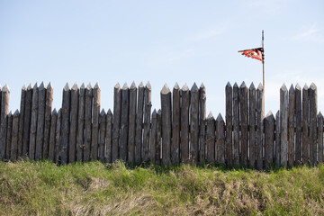 Old gray wooden fence wall of a house