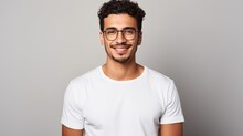 Attractive Young Mexican Man Wearing A White T-shirt And Glasses. Isolated On White Background.