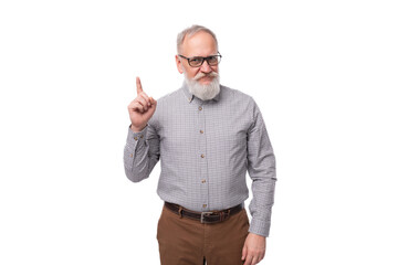 Wall Mural - modern smart gray-haired mature businessman with a beard and mustache in a shirt and trousers on a white background