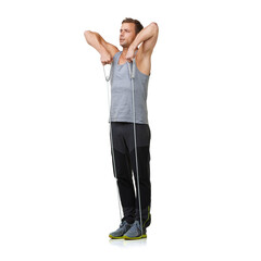 Wall Mural - Workout, man and stretching a resistance band in studio, gym and fitness training for strong muscles. Sports person, exercise and commitment by gym equipment in mockup and cardio by white background