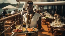 Portrait Of An African-American Man Holding A Tray With Luxurious Dishes Intended For Passengers Traveling On A Luxury Liner During The Summer Holidays. A Waiter Stands With A Tray In His Hands On The