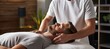 © Ilja - Professional masseur giving massage on white table, bright light, copy space for text