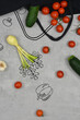 Photo combined with graphics: vegetables falling of a black mesh on a light background. Png ready to use.