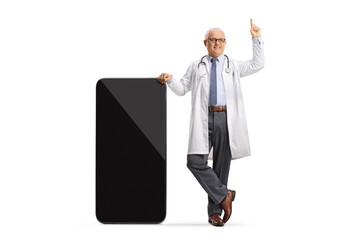 Poster - Male doctor leaning on a smartphone and pointing up