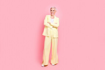 Sticker - Full body photo of businesswoman yellow suit crossed arms posing at new york times international magazine isolated on pink color background