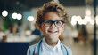 Blond Smiling happy boy wearing glasses stands in an optical store near showcase with glasses. Vision correction, glasses store visually impaired children.