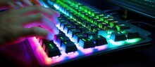 Working On A Neon Computer Keyboard With Colored Backlighting. Selected Focus