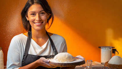 Apron-clad Female Chef Preparing Healthy Dough in a Professional Kitchen