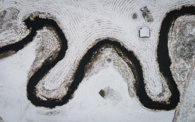 Natural river between the forest  winter- aerial high view