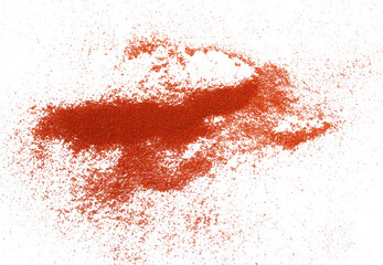 Wall Mural - Pile of red paprika powder scattered isolated on white, top view