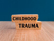 © Liudmila - Childhood trauma symbol. Concept words Childhood trauma on brick blocks. Beautiful dark blue background. Business psychology childhood trauma concept. Copy space.