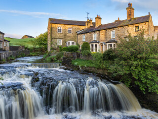 Wall Mural - Waterfall on Gayle Beck in the centre of the Yorkshire Dales town of Hawes, Wensleydale. Taken early morning.