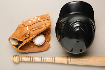 Baseball glove, bat, ball and batting helmet on light grey background, flat lay