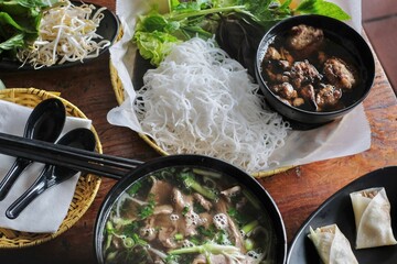 Bun cha with grilled pork and meatballs, Hanoi-style pho tai land and Peking duck wraps at VN Street Foods, a North Vietnamese street food restaurant in Sydney’s inner west -Marrickville, NSW