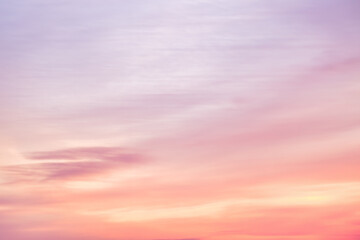 Wall Mural - A beautiful sky tinted by the sun leaving vibrant shades of gold, pink, blue and multicolored. Clouds in the twilight evening and morning sky. Image of a cloudy sky in the evening and during the day