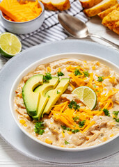 Canvas Print - white chicken chili with cheese, avocado in bowl