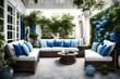 Beautiful outdoor patio or courtyard. Two cushioned chairs and a sofa - couch with blue and white pillows