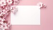 a white rectangular card with pink flowers on it