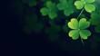 four leaf clover on green shamrock background. Green clover leaf isolated on dark background. with three-leaved shamrocks. St. Patrick's day holiday