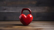 Kettlebell made from red heart on wooden background promotes fitness and Valentines day with copyspace for text