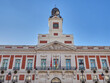 Facade of Casa de Correos, former post office building and currently headquarters of the Madrid regional government, with the famous clock on top. Puerta del Sol, Madrid, Spain, Europe