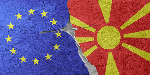 European Union and Montenegro flags on a stone wall with a crack, illustration of the concept of a global crisis in political and economic relations