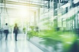 Fototapeta Natura - Blurred background business people walking in the hall of modern glass office, business center, shopping center, bank. Business concept, modern interior with living green plants. Eco style