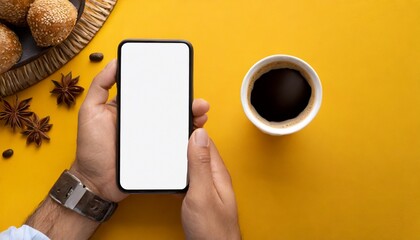 Hands holding modern smart phone mockup, yellow background 