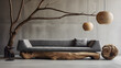 Un salon contemporain avec un canapé en tissu gris sur une base en bois naturel sculpté.