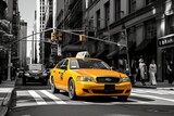 Fototapeta Koty - Vibrant New York City Street Scene. Busy Intersection with Pedestrian Crossings and Yellow Taxi Cabs