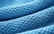 Light blue sweater close-up,created with Generative AI tecnology.