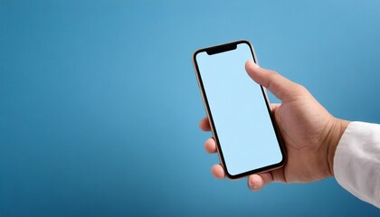 Hand using smartphone with blank screen, isolated on blue background, text space
