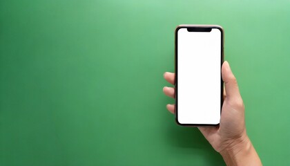 Hand using smartphone with blank screen, isolated on green background 