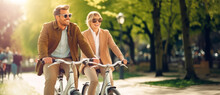 An Adult Couple Rides Bicycles In A Spring Green Park With A Joyful And Peaceful Mood Of Happiness. Outdoor Fitness. Healthy Lifestyle. Generative AI