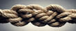 Tightly knotted rope, symbolizing strength and resilience.