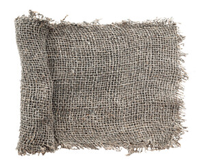 Wall Mural - Burlap texture. A piece of torn burlap on a white background. Canvas. Packing material