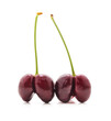 Ripe cherries in the shape of a heart.