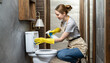 Housework or house keeping service female cleaning dust in toilet, cleaning agency small business. professional equipment cleaning old home.