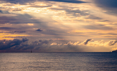 Wall Mural - The view of the ocean and the cloudscape in the sunset from Palm Cove Beach