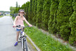 © Luci - Young girl cyclist enjoy the beautiful sunrise on summer forest trail