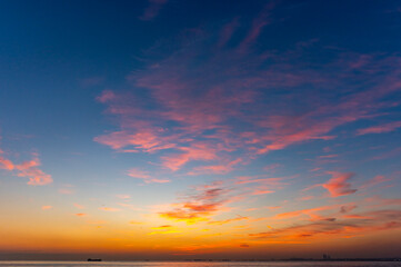 Wall Mural - Sunset sky. Beautiful cloudy sunset sunrise sky. Orange and blue colors. Fiery orange sunset sky.