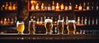 Beer glass and bottles on bar counter with space for text.