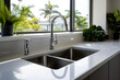 modern kitchen set with stainless steel undermount sink and high-arc faucet.