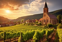 Summer Sunset View Of The Medieval Church Of Saint-Jacques-le-Major In Hunawihr, Small Village Between The Vineyards Of Ribeauville, Riquewihr And Colmar In Alsace, Wine Making Region Of France
