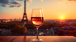 Glass of wine sunset Eiffel Tower background. Selective focus.