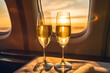 Two glasses of champagne on board the plane during the trip