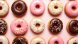 Donuts pattern. Different types of donuts on bright background. Chocolate, glaze and caramel donuts
