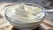 Fresh whipped cream in a bowl.